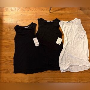 Three NWT Athleta daily tees oversized two are size sm and one is a med.